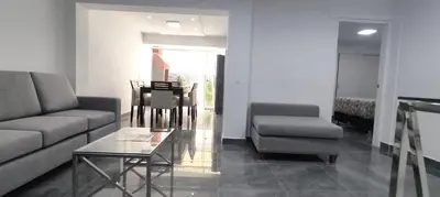 a living room with a couch and a table at El Polo Surco in Lima