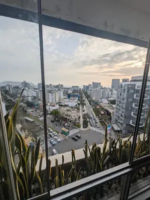 a view of a city from a window at Guernica Apartments in Lima