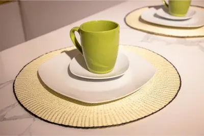 a green coffee cup on a plate on a table at Private room by the sea Miraflores in Lima