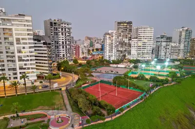 an aerial view of a tennis court in a city at Private room by the sea Miraflores in Lima