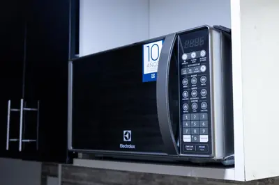 a microwave oven sitting on top of a shelf at Modern Duplex by the sea Miraflores in Lima
