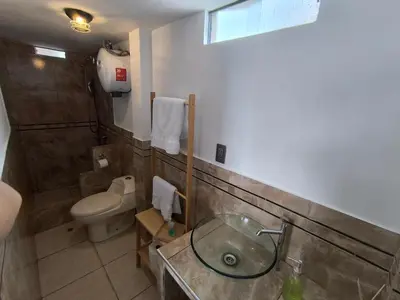 a bathroom with a sink and a toilet at home Blessed III in Lima
