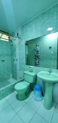 a bathroom with a toilet and a sink at Hospedaje El Paraiso in Santa Eulalia