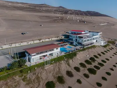 an aerial view of a building next to a desert at Vista a Mar in Huaral