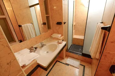 a bathroom with a sink and a shower at Hotel Samanapaq in Ollantaytambo