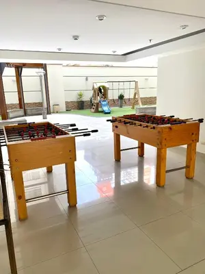 two ping pong tables in a room with a playground at Vista Brasil Dúplex in Lima
