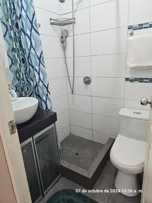 a bathroom with a sink and a toilet and a shower at Departamento Pueblo Libre in Lima