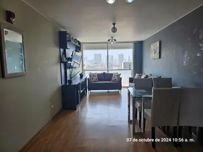 a living room with a couch and a table at Departamento Pueblo Libre in Lima