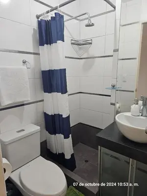 a bathroom with a toilet and a sink at Departamento Pueblo Libre in Lima