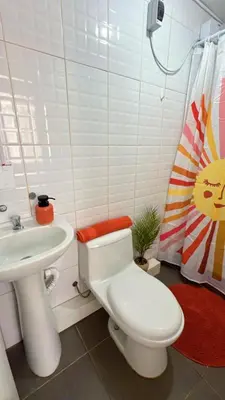 a bathroom with a white toilet and a sink at loft apartament residencial ICA in Ica