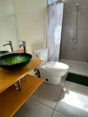 a bathroom with a sink and a toilet at Duplex panorámico in Cusco