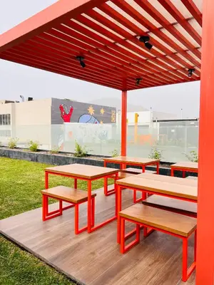 a group of picnic tables and benches on a deck at MONTERRICO POLO APARTS #20 - DEPARTAMENTO DELUXe FRENTE EMBAJADA USA in Lima