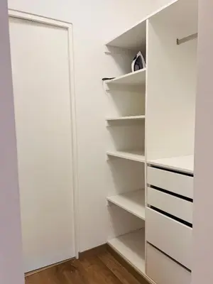 a closet with white walls and white shelves at MONTERRICO POLO APARTS #20 - DEPARTAMENTO DELUXe FRENTE EMBAJADA USA in Lima