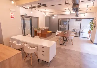 a room with a table and chairs and a dining room at Estreno en barranco BR1 in Lima