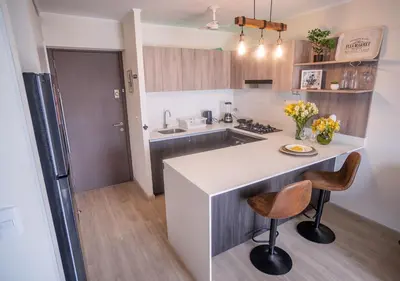 a kitchen with a white counter and a sink at Estreno en barranco BR1 in Lima