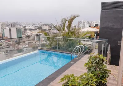 a swimming pool on the roof of a building at Estreno en barranco BR1 in Lima