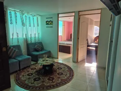 a living room with a couch and a table at Casa Mirador San Blas II in Cusco