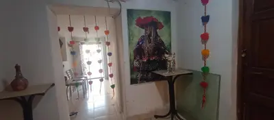 a room with a painting of a woman on the wall at Hospedaje Rosita INN in Cusco