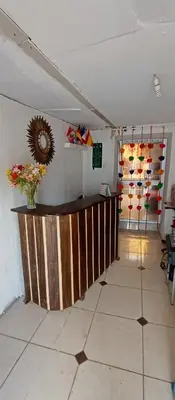 a room with a counter with a vase of flowers at Hospedaje Rosita INN in Cusco