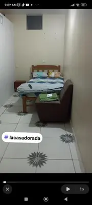 a bedroom with a bed in a room at La casa dorada in Huacho