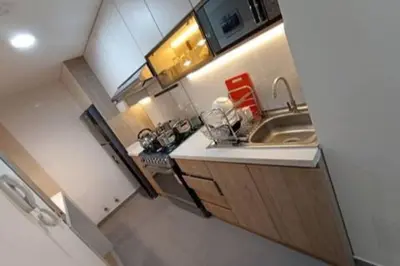 a small kitchen with a sink and a counter at Departamento en estreno Alameda Central in Lima