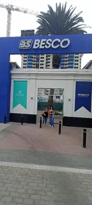 two people are standing in front of aissoco building at Departamento en estreno Alameda Central in Lima
