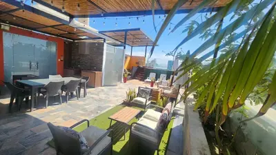 a patio with a table and chairs and a dining room at Departamento exclusivo ica in Ica