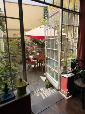 a view of a patio through a glass door at Miraflores Moonlight B&B in Lima