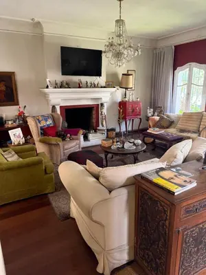 a living room filled with furniture and a fireplace at Miraflores Moonlight B&B in Lima