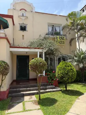 a house with a sign that reads as a home remedies at Miraflores Moonlight B&B in Lima