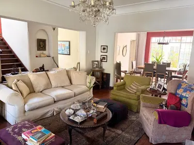 a living room with a couch and chairs and a table at Miraflores Moonlight B&B in Lima