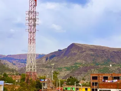 a tall tower in front of a mountain at Casa Límaco in Ayacucho