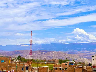 a view of a city with a cell phone tower at Casa Límaco in Ayacucho