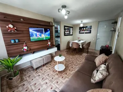 a living room with a couch and a flat screen tv at Departamento en Ate in Lima