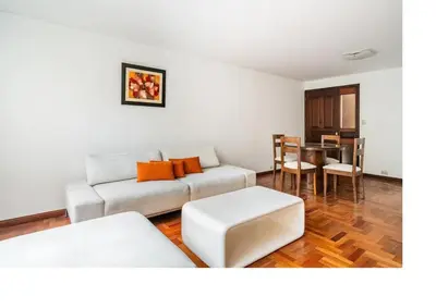 a living room with a couch and a table at San Borja Pentagonito in Lima