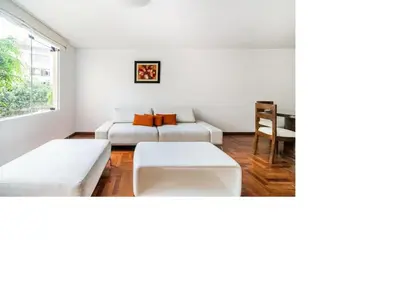 a living room with a couch and a table at San Borja Pentagonito in Lima