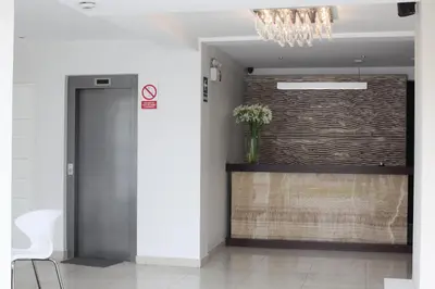 a hallway with a door and a wall at Park Hotel Lima in Lima