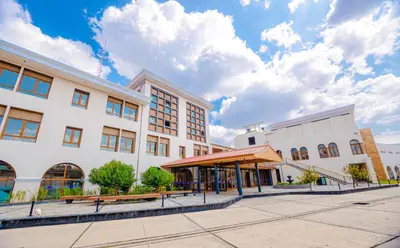 an empty street in front of a building at Hotel Andesmar Huancayo in Huancayo