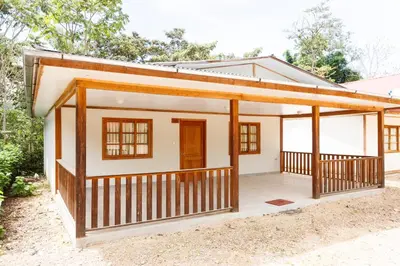 a small house with a porch at Cabañitas San José in Oxapampa