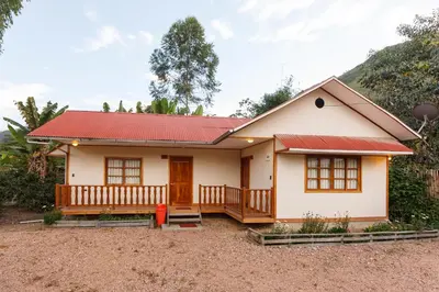 a small house with a red roof at Cabañitas San José in Oxapampa