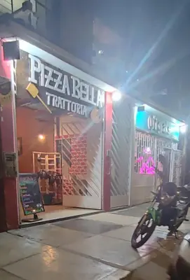 a motorcycle parked outside of a store at night at Sumaq Apartment Lima Airport in Lima