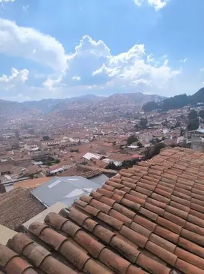 a view of a city from the roof of a building at Kusi Wasi in Cusco