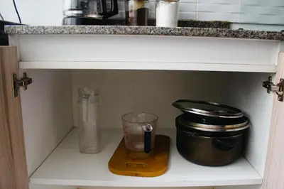 a kitchen shelf with a blender and a counter at Arleth's hosting in Lima
