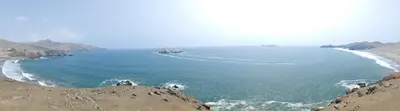 a large body of water with rocks in the ocean at bungalows in Santa Rosa