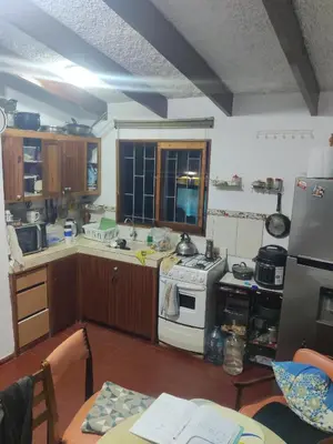 a kitchen with a white stove top oven at bungalows in Santa Rosa