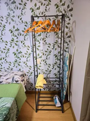 a shelf with orange shoes on it in a room at El Refugio de Katte VI in Lima