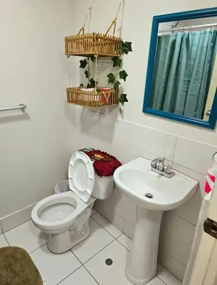 a bathroom with a toilet and a sink at El Refugio de Katte VI in Lima