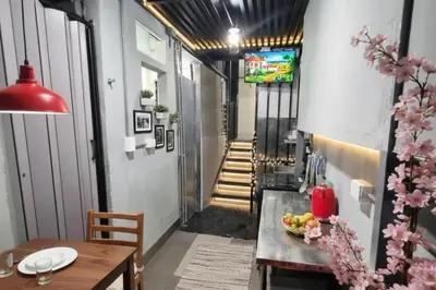 a dining room with a table and a hallway at Departamento en el Centro Historico de Lima Perú in Lima