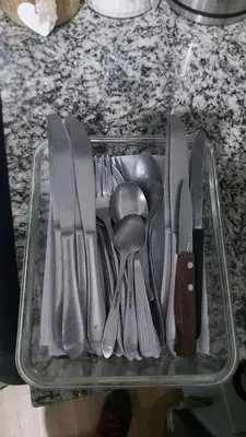 a tray full of utensils sitting on a counter at Lovely & quiet place, park view & private parking in Lima