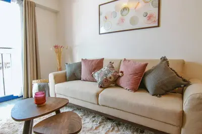 a living room with a couch with pillows on it at Moderno Loft a Pasos del Centro in Cusco